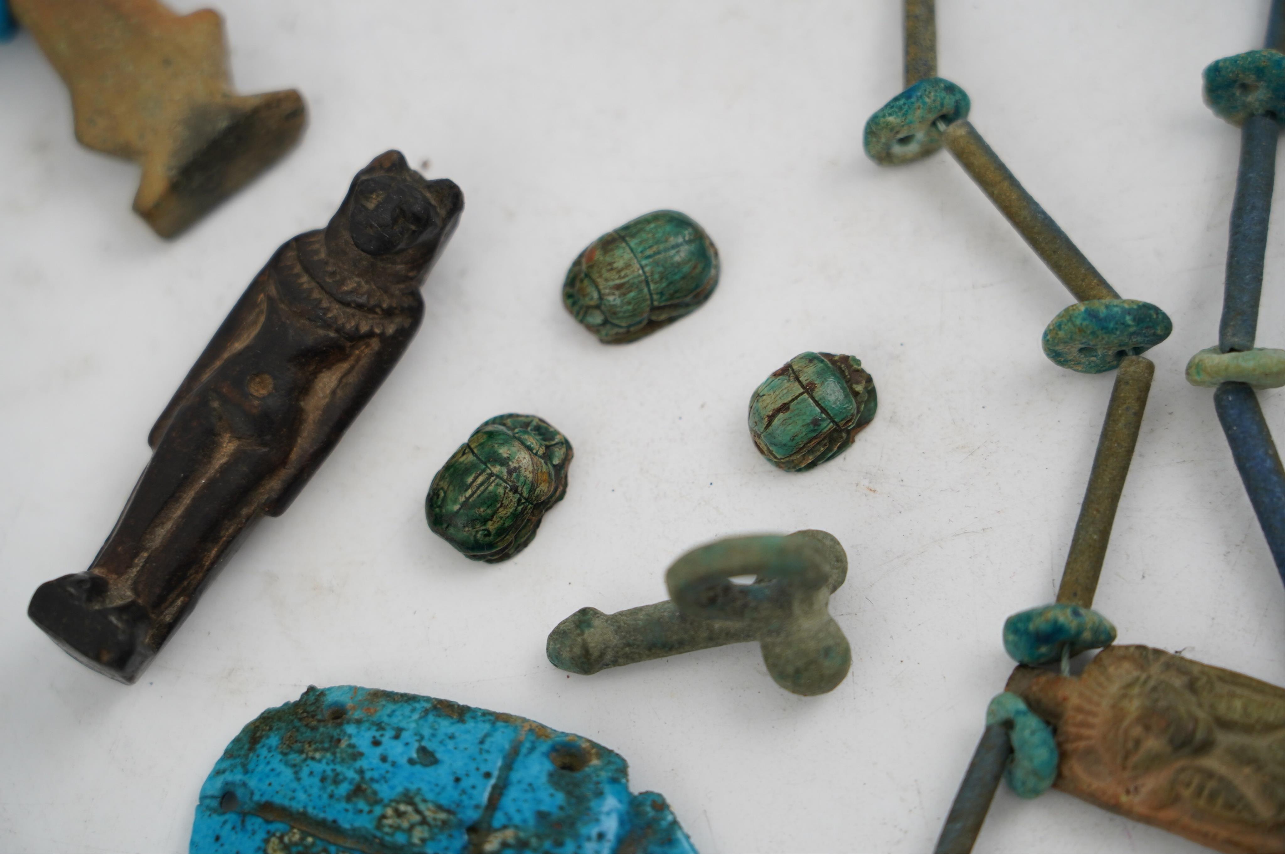 An ancient Egyptian faience necklace, amulets and scarabs, late Kingdom to Ptolemaic period